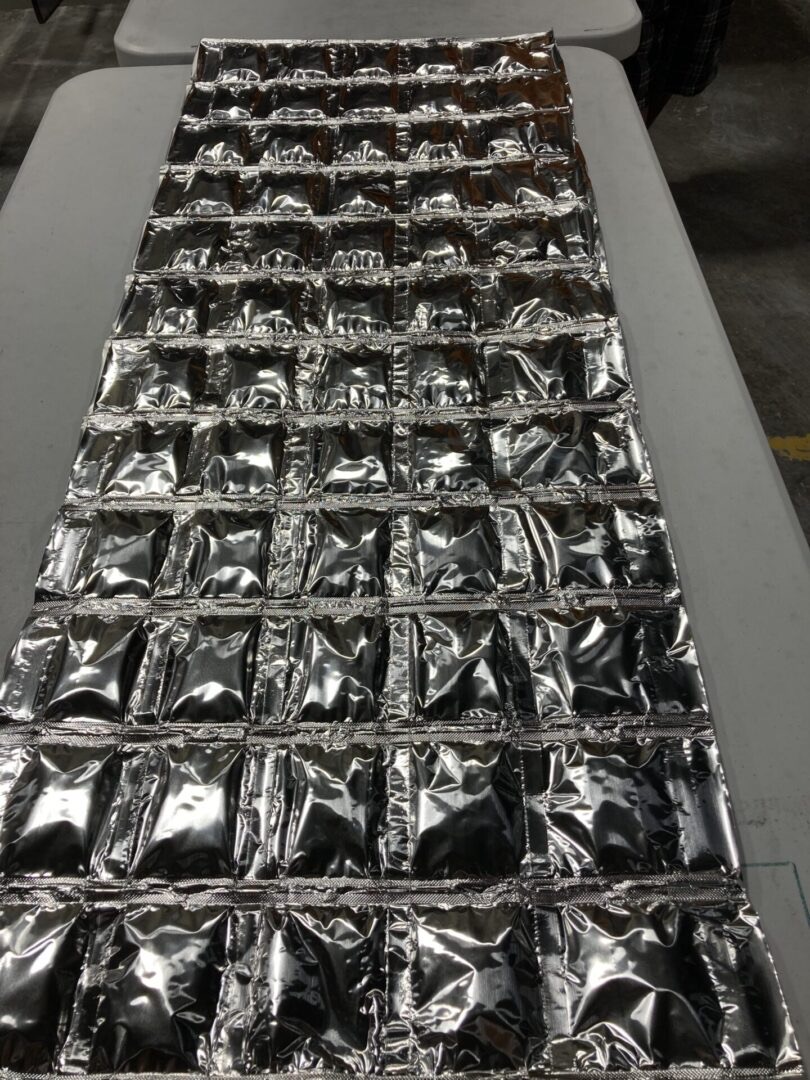 An EnigMAT mat laid out on a workbench